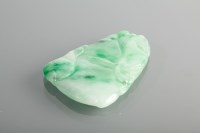 Lot 1178 - CARVED SECTION OF JADE with various tones of...