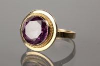 Lot 1179 - PURPLE GEM SET DRESS RING set with a brilliant...