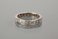 Lot 1180 - EARLY TWENTIETH CENTURY DIAMOND ETERNITY RING...