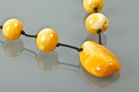 Lot 1201 - UNUSUAL AMBER BEAD NECKLACE formed by...