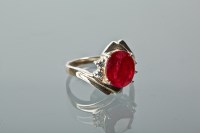 Lot 1213 - RUBY AND WHITE SAPPHIRE DRESS RING set with an...