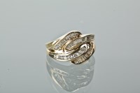 Lot 1221 - DIAMOND DRESS RING the bezel formed by two...