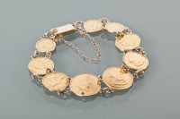 Lot 1233 - GOLD COIN BRACELET with gold 1 dollar coin...