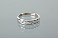 Lot 1241 - DIAMOND HALF ETERNITY RING set with ten...