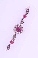 Lot 2024 - RUBY AND DIAMOND BAR BROOCH set centrally with...