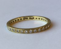 Lot 2027 - DIAMOND FULL ETERNITY RING channel set with...