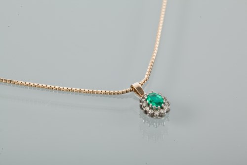 Lot 1300 - EMERALD AND DIAMOND CLUSTER PENDANT the...