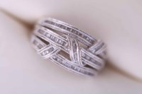 Lot 2030 - DIAMOND DRESS RING of three banded twist...