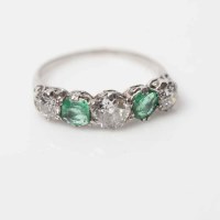 Lot 2032A - EMERALD AND DIAMOND FIVE STONE RING set with...