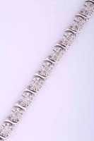 Lot 2036 - DIAMOND LINE BRACELET with illusion set...