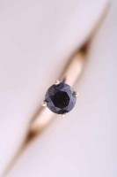 Lot 2037 - BLACK DIAMOND SOLITAIRE RING with a central...