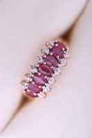 Lot 2041 - RUBY AND DIAMOND CLUSTER RING set with seven...