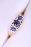 Lot 2055 - VICTORIAN SAPPHIRE THREE STONE RING set with...