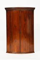 Lot 232 - EARLY 19TH CENTURY MAHOGANY BOWFRONT CORNER...