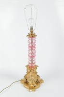 Lot 236 - EDWARDIAN CRANBERRY GLASS AND BRASS TABLE LAMP...