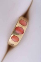 Lot 2066 - VICTORIAN CORAL THREE STONE RING with a three...