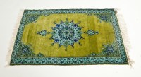 Lot 315 - KASHMIR RUG with central star on a green...