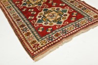 Lot 327 - CAUCASIAN RUG mid 20th century, with two...