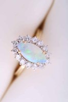 Lot 2070 - OPAL AND DIAMOND CLUSTER RING with a central...