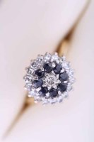 Lot 2072 - SAPPHIRE AND DIAMOND CLUSTER RING set with...