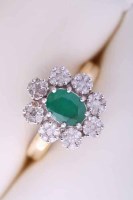 Lot 2075 - EMERALD AND DIAMOND CLUSTER RING set with an...