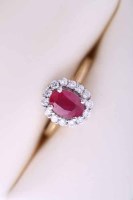 Lot 2076 - RUBY AND DIAMOND CLUSTER RING the oval ruby...