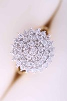 Lot 2078 - DIAMOND CLUSTER RING the pierced circular...