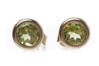 Lot 510 - PAIR OF PERIDOT EARRINGS each with a collet...