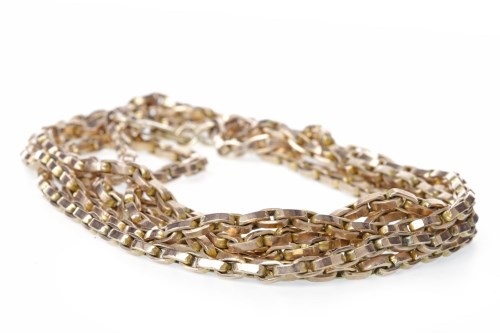 Lot 519 - GOLD CHAIN NECKLACE formed by three strands of...