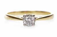 Lot 563 - DIAMOND SOLITAIRE RING with a four claw set...