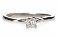 Lot 647 - PLATINUM DIAMOND SOLITAIRE RING mounted with a...