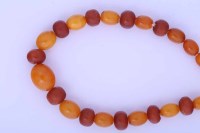 Lot 2109 - YELLOW AMBER BEAD NECKLACE the smallest bead 7....