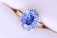 Lot 2120A - TANZANITE AND DIAMOND CLUSTER RING the central...