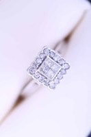 Lot 2129 - DIAMOND CLUSTER RING the square bezel set with...