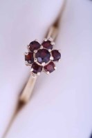 Lot 2131 - FOURTEEN CARAT GOLD GARNET CLUSTER RING the...