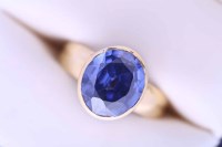 Lot 2150A - TANZANITE RING set with an oval tanzanite of...