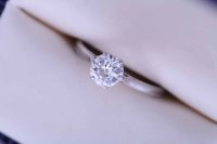 Lot 2152 - DIAMOND SOLITAIRE RING the brilliant cut stone...