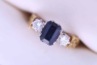 Lot 2153 - SAPPHIRE AND DIAMOND THREE STONE RING the...