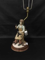 Lot 132 - TABLE LAMP MODLED AS A YOUNG COBBLER and a toy...