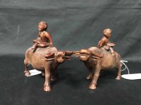 Lot 167 - TWO CHINESE CARVED WOODEN FIGURES ON BUFFALO