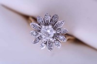 Lot 2180 - DIAMOND CLUSTER RING of floral form, with a...