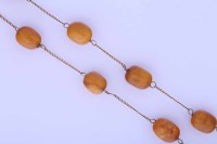 Lot 2206 - AMBER BEAD NECKLACE with amber beads strung on...