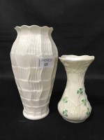 Lot 121 - TWO BELLEEK VASES AND A CAST METAL FIGURE (3)