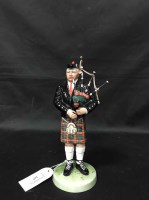 Lot 167 - ROYAL DOULTON FIGURE OF 'THE PIPER' modelled...