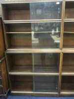 Lot 244 - PAIR OF OAK SECTIONAL BOOKCASES with sliding...