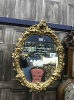 Lot 330 - OVAL GILT FRAMED WALL MIRROR and cream painted...