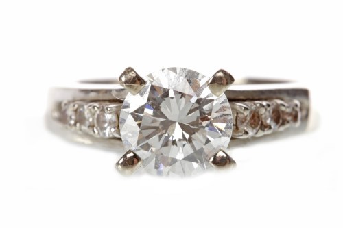 Lot 44 - DIAMOND SOLITAIRE RING set with a four claw...