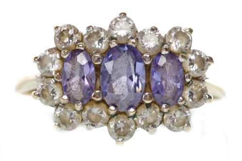 Lot 56 - GEM SET RING set with a central row of oval...