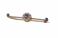 Lot 82 - DIAMOND AND SAPPHIRE BROOCH formed by a...
