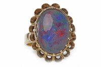 Lot 108 - OPAL TRIPLET DRESS RING set with a large oval...